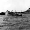 The capsized USS Oklahoma, 7 December 1941, Pearl Harbor. Nearly 400 remains were buried in mass graves in Hawaii.